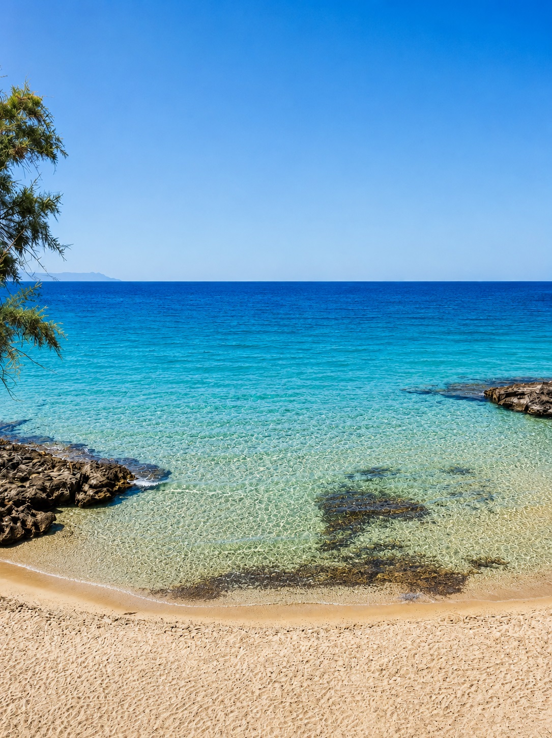 Shallow turquoise water and the small islet off Kalathas Beach, Akrotiri, Chania